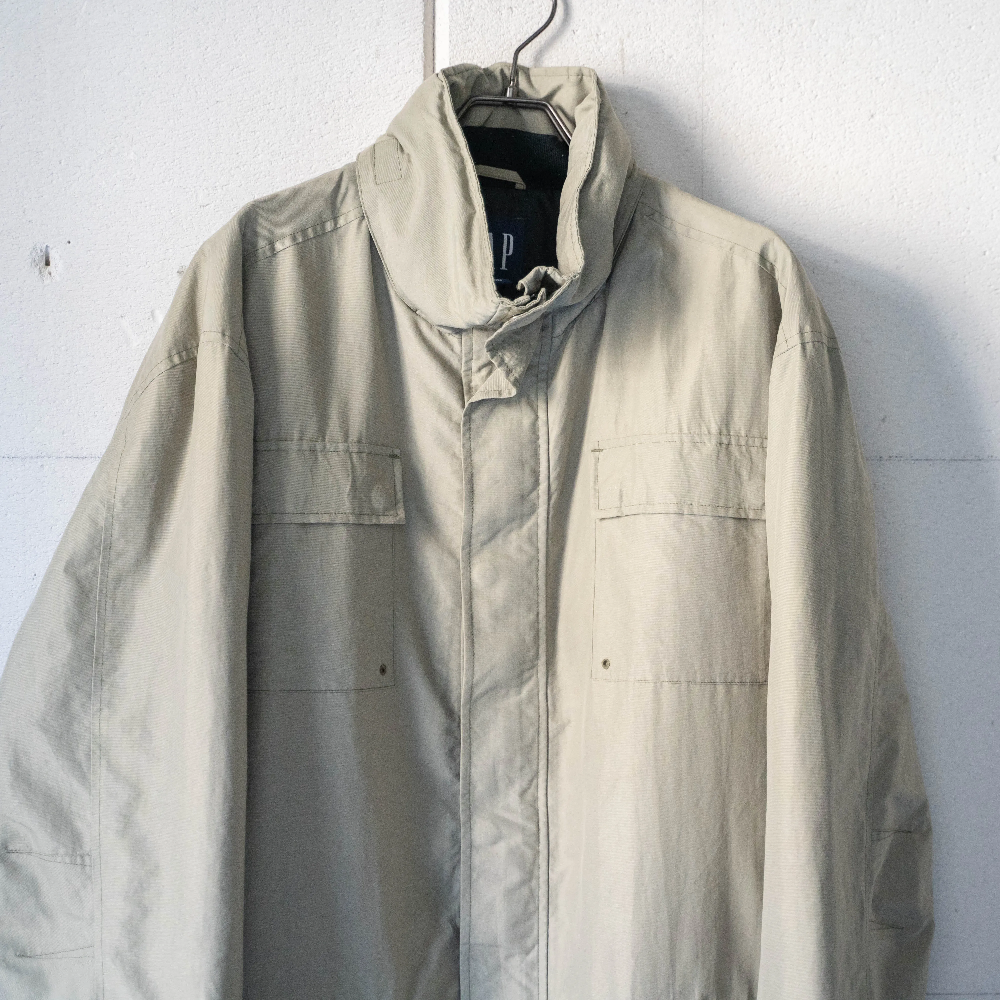 Sure! Here’s an optimized title for the e-commerce product:

Vintage 1990s GAP Greige Nylon Outdoor Jacket - Lightweight, Waterproof, Stylish & Functional